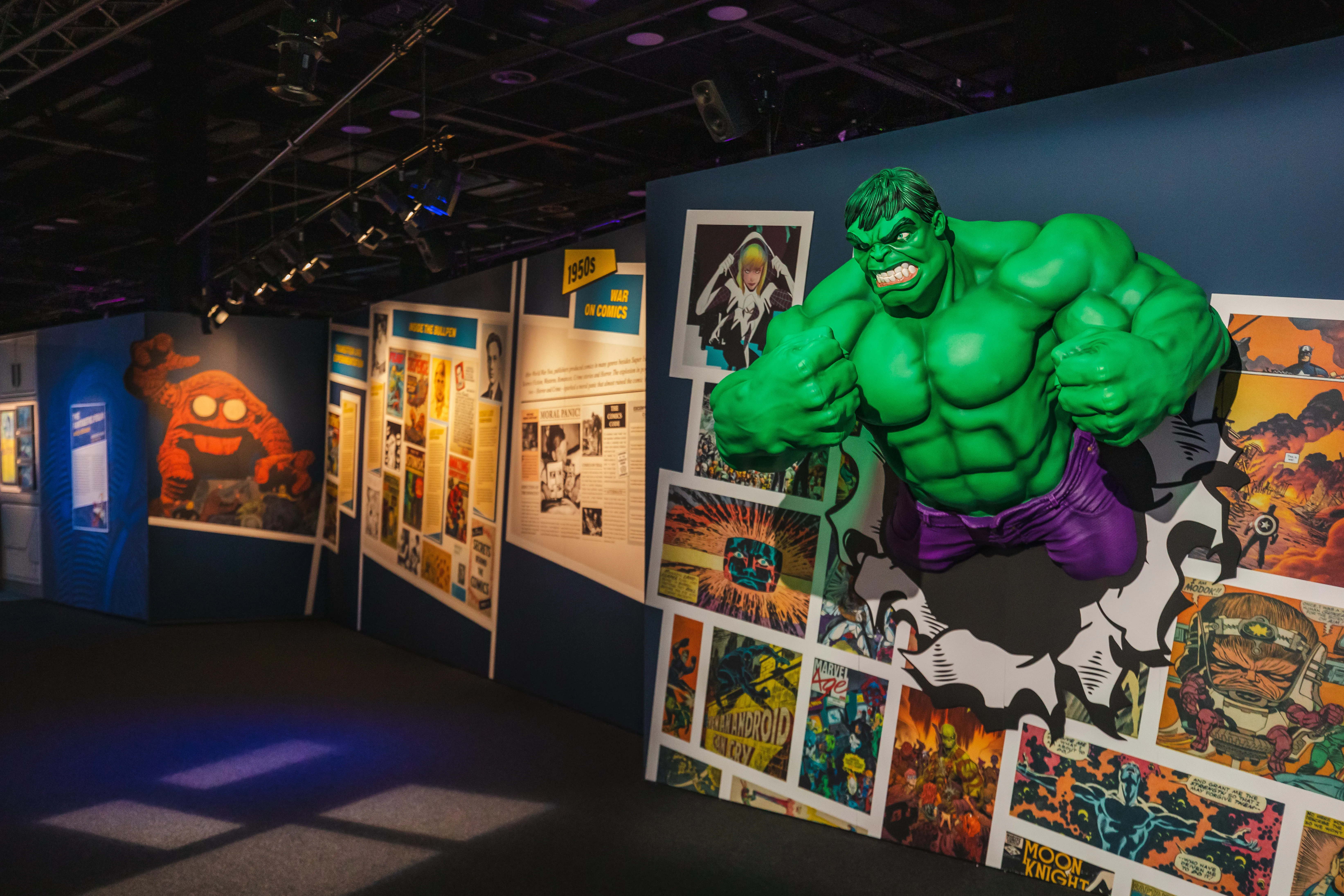 Image from Marvel: The Exhibit of Hulk breaking out of a wall.